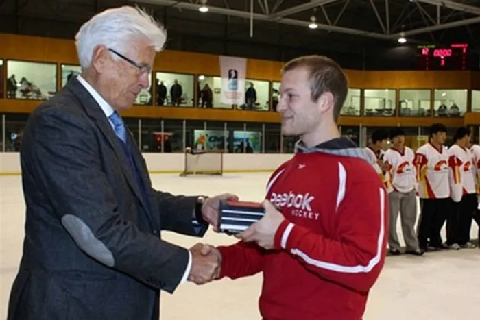 Radosvet Petrov receiving a reward for being the best player at a national tournament