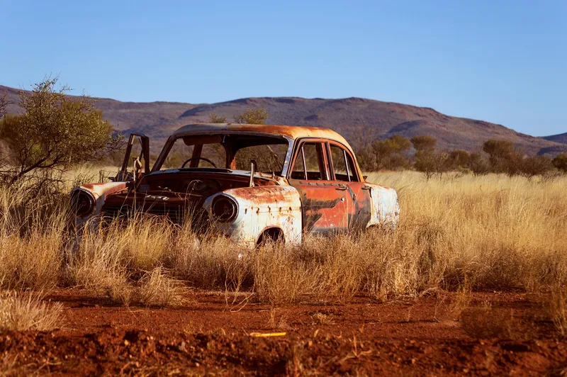Illustration of old car left in the desert